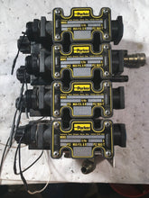 Load image into Gallery viewer, 4 PARKER 5000 PSI D1VW20BNYCF SOLENOID VALVES on a manifold