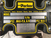 Load image into Gallery viewer, 4 PARKER 5000 PSI D1VW20BNYCF SOLENOID VALVES on a manifold